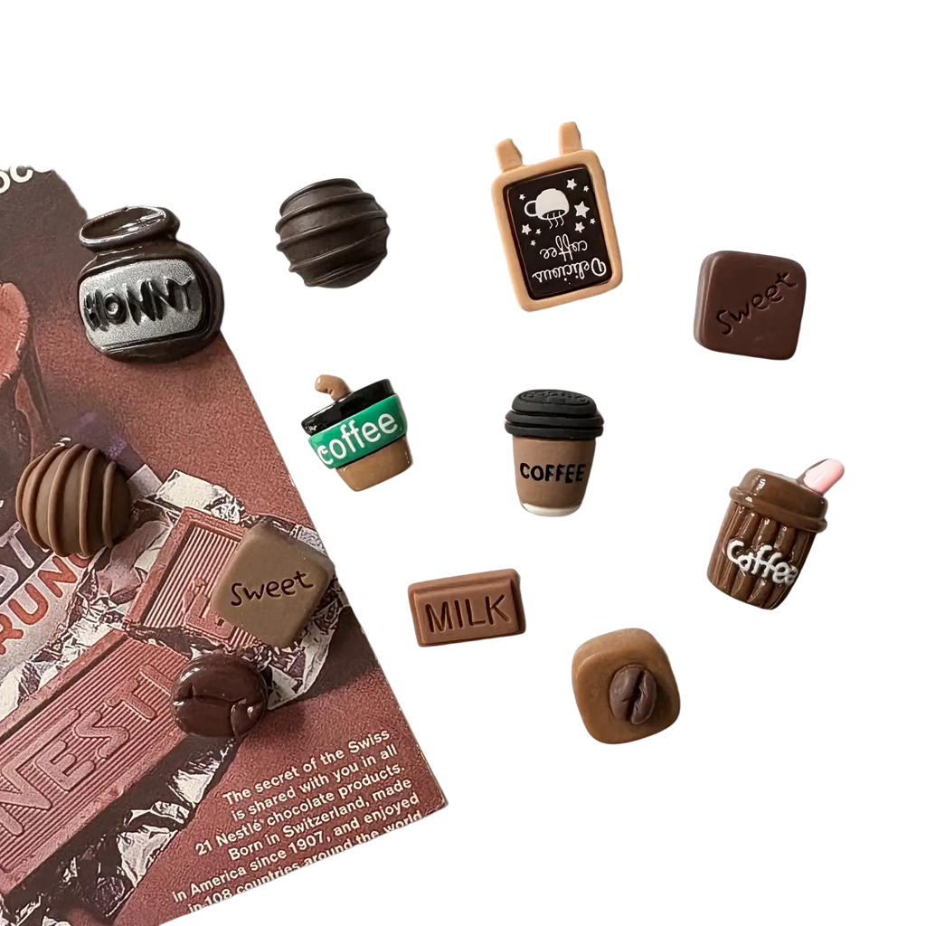 12pcs mini coffee-themed fridge magnets in brown and black with playful coffee cup, milk carton, and candy bar designs