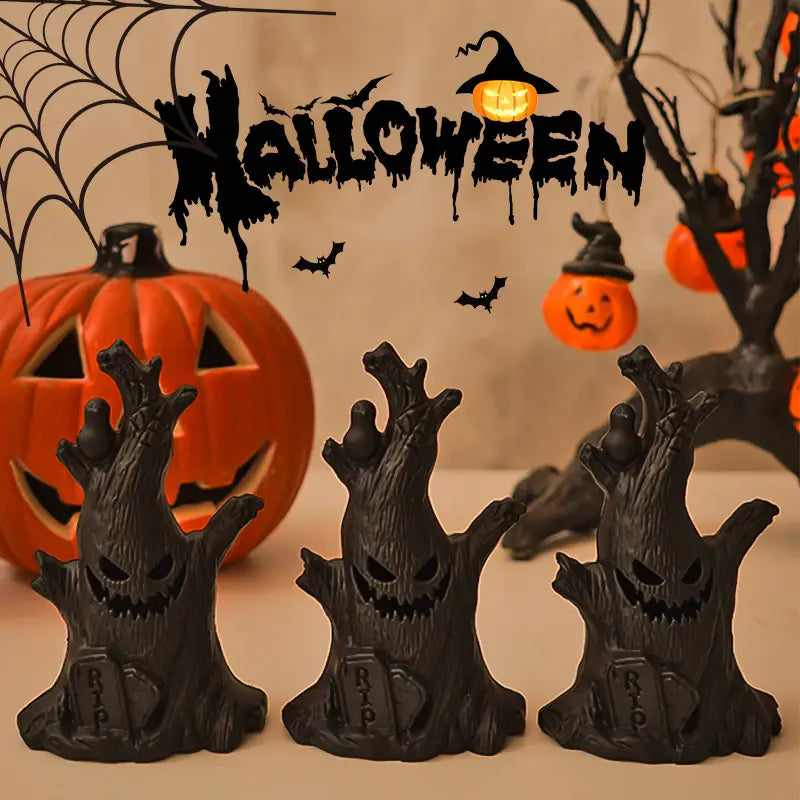three black plastic led halloween ghost tree light figurines with carved faces and rip inscriptions for spooky graveyard decoration
