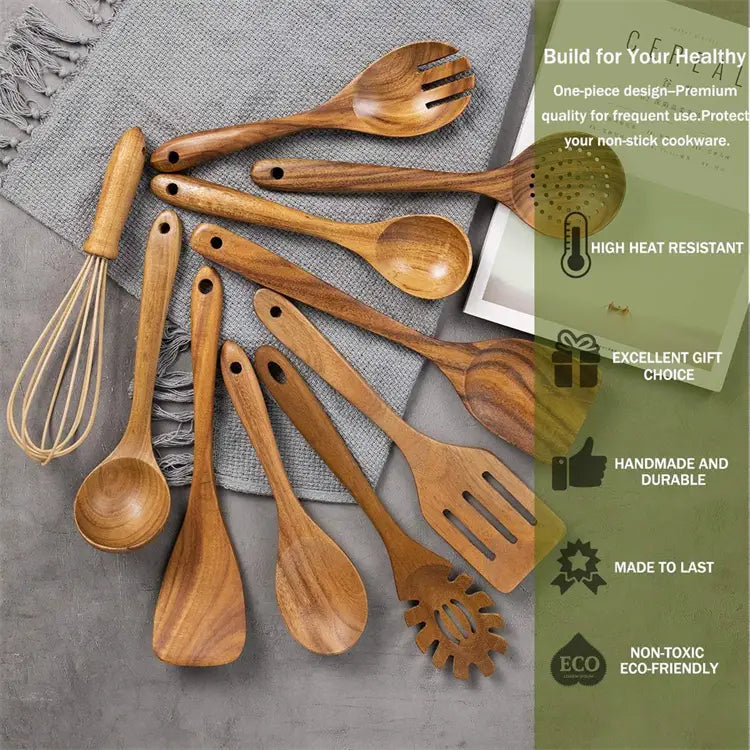 Set of wooden kitchen utensils including spoons spatulas and a whisk made from natural wood with visible grain in warm brown tones for cooking use.