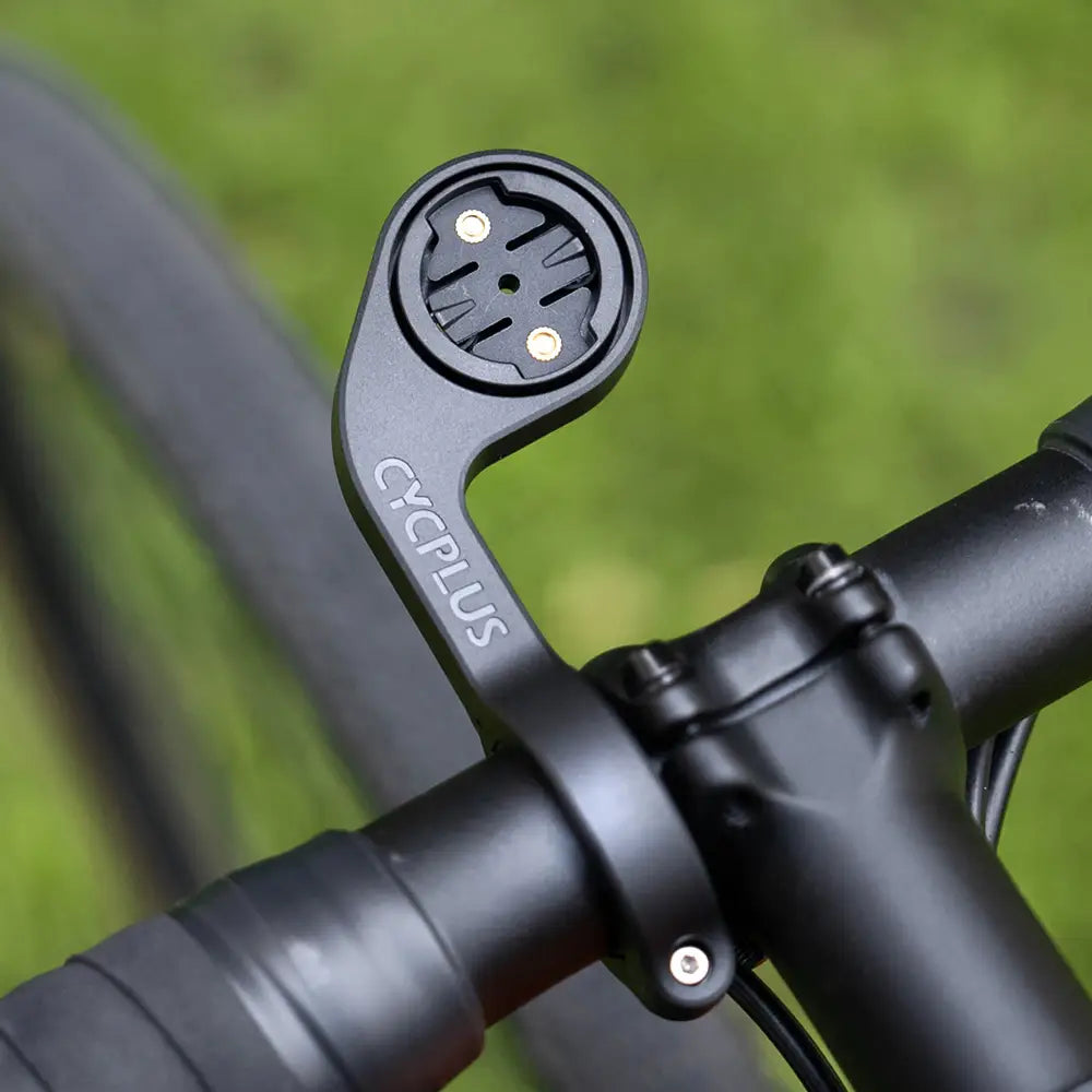 Black cycplus Z1 outfront GPS bike computer mount handlebar mount with circular mounting plate and two gold-colored screws shown from the back side.