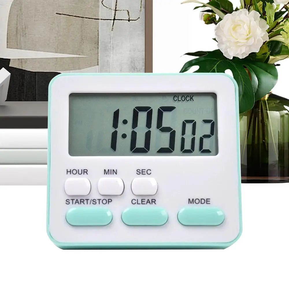 Ein eleganter rechteckiger digitaler Küchentimer mit weißem Gehäuse und hell-mintgrünem Zierstreifen. Er verfügt über ein klares LCD-Display mit schwarzen Ziffern für die Verwendung einer geräuschlosen Countdown-Uhr.