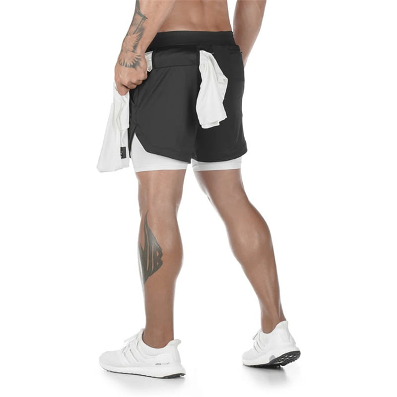 Men 2 in 1 gym shorts featuring a sleek black and white layered design made from quick dry material for workout and activewear use.