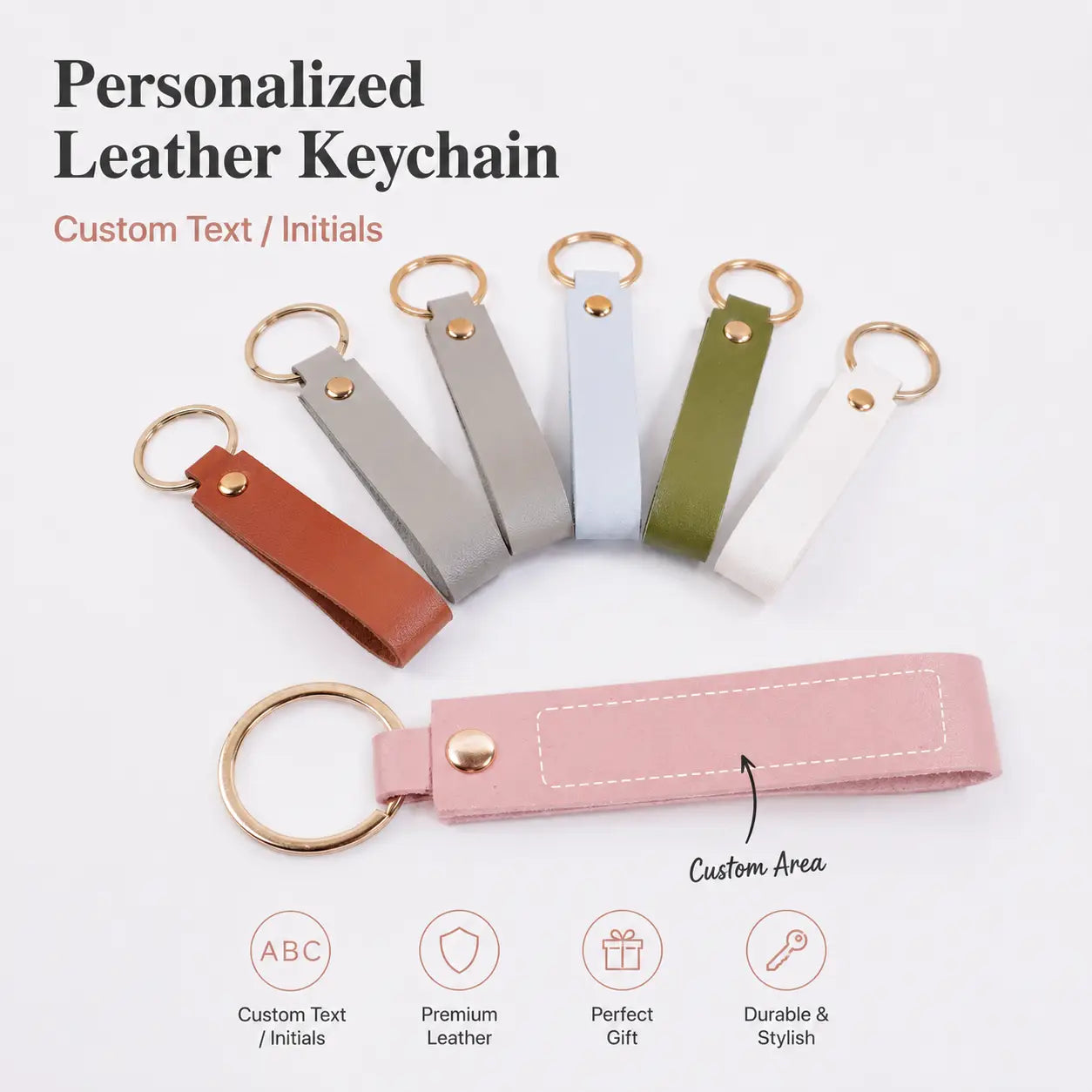 Custom name pink leather keychain featuring a pink leather body with a gold-toned ring and button closure.