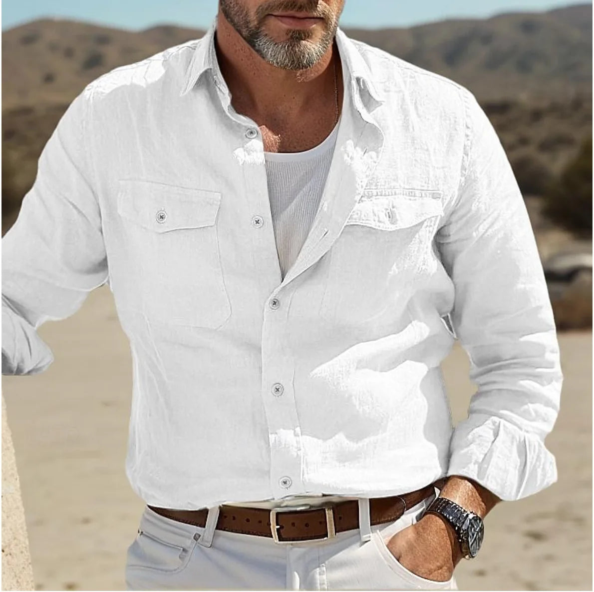 men casual linen button up shirt in white featuring long sleeves, two chest pockets, and a relaxed, slightly textured fabric.