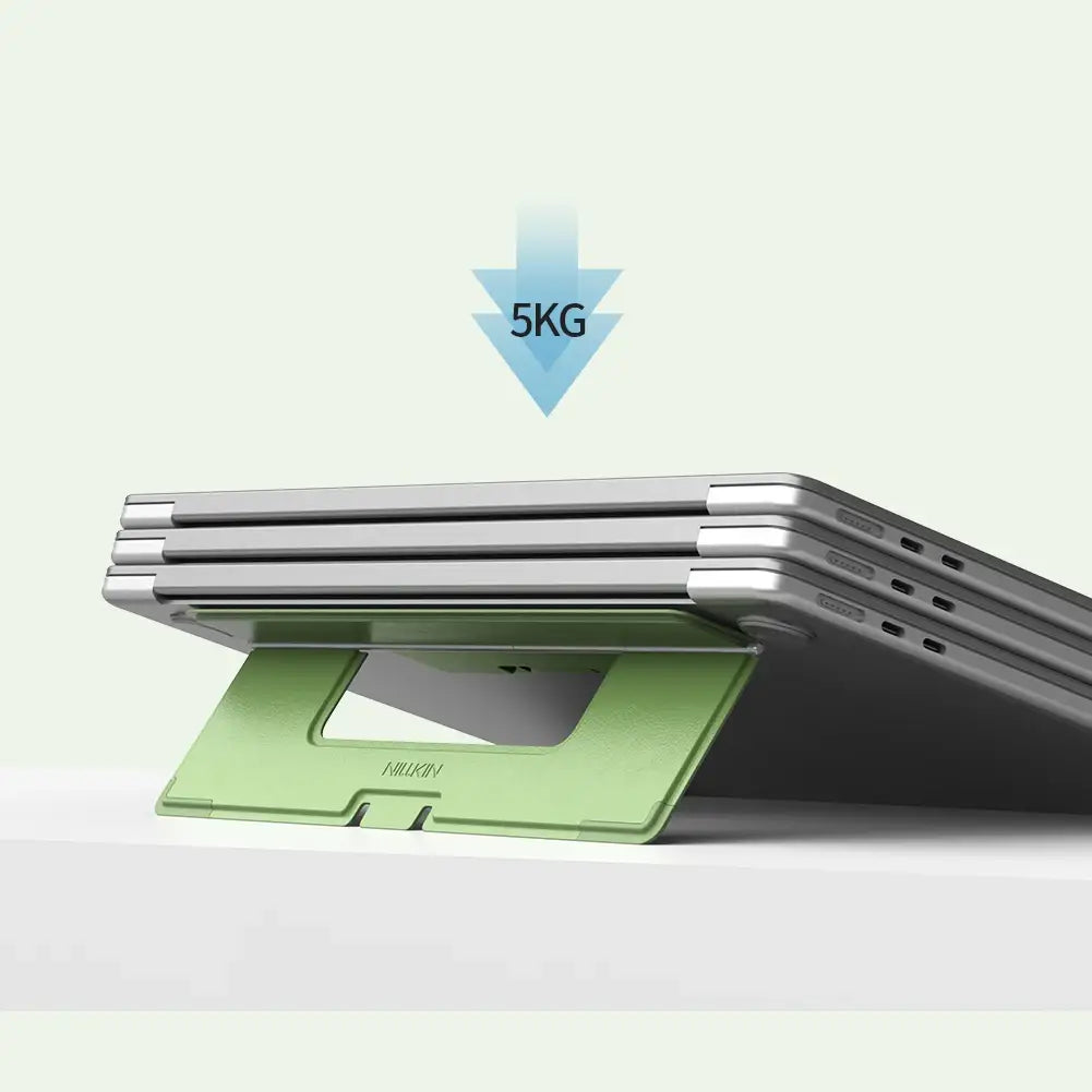 Light green plastic Nillkin dualwing adhesive laptop stand supporting a stack of silver tablets as a computer bracket type.