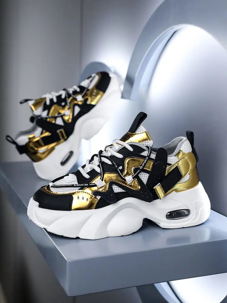 Men chunky air cushion casual sneakers in black and gold with white mesh accents and a visible air cushion unit.