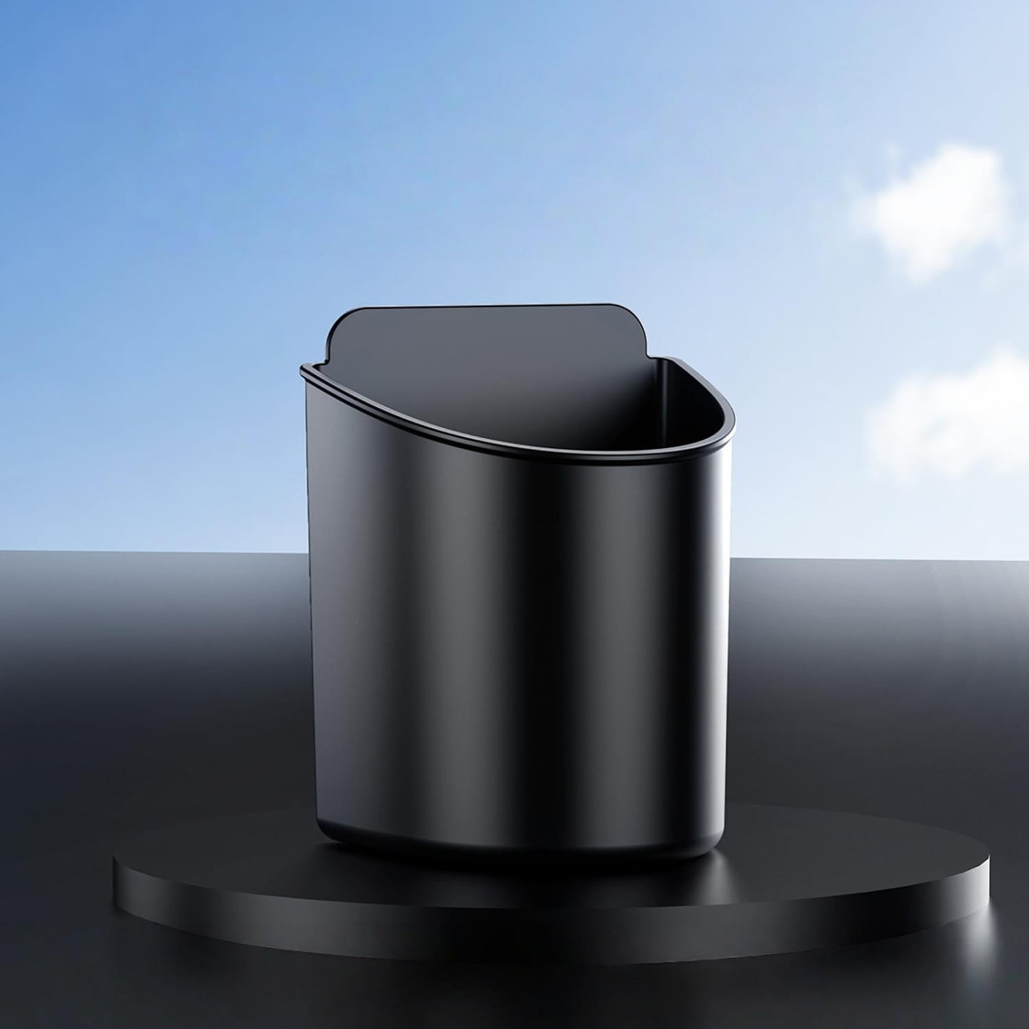 Black cylindrical car door cup holder with a sleek modern design and smooth metallic finish serving as a car trash bin for vehicles.
