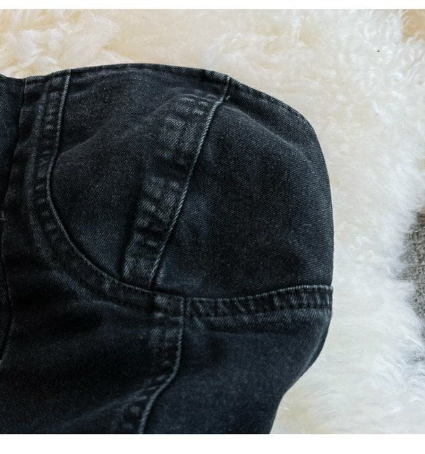 dark-wash denim fabric with visible stitching and a slightly worn texture for a denim jumpsuit off shoulder summer romper