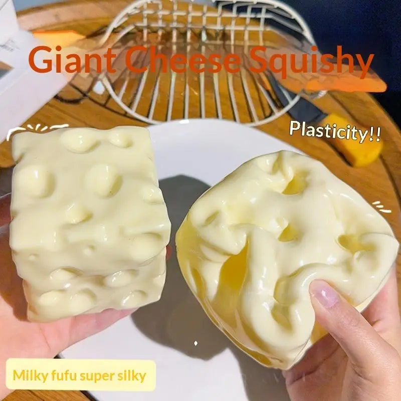 Cream-colored squishy cheese-shaped fidget toy made of glossy plastic with molded holes measuring 6cm by 6cm designed for stress relief.