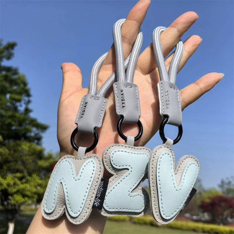 A To Z Leather Initials Keychain Braied Wristband Pendant Keyring for Women Men Car Bag Charms Camera Phone Case Accessories