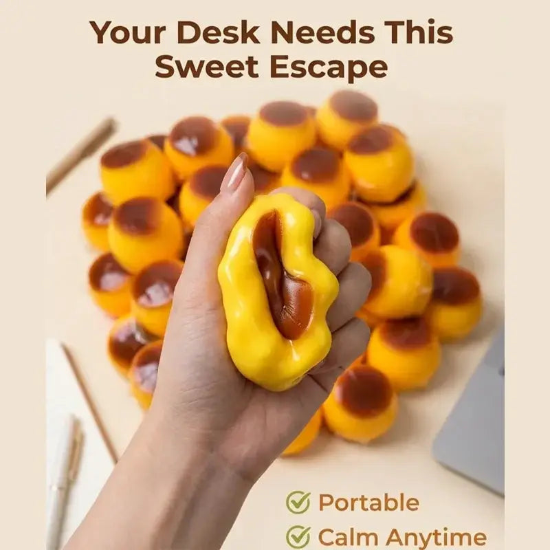 Front view of a yellow and brown caramel-filled stress ball with a glossy, squishy texture for stress relief
