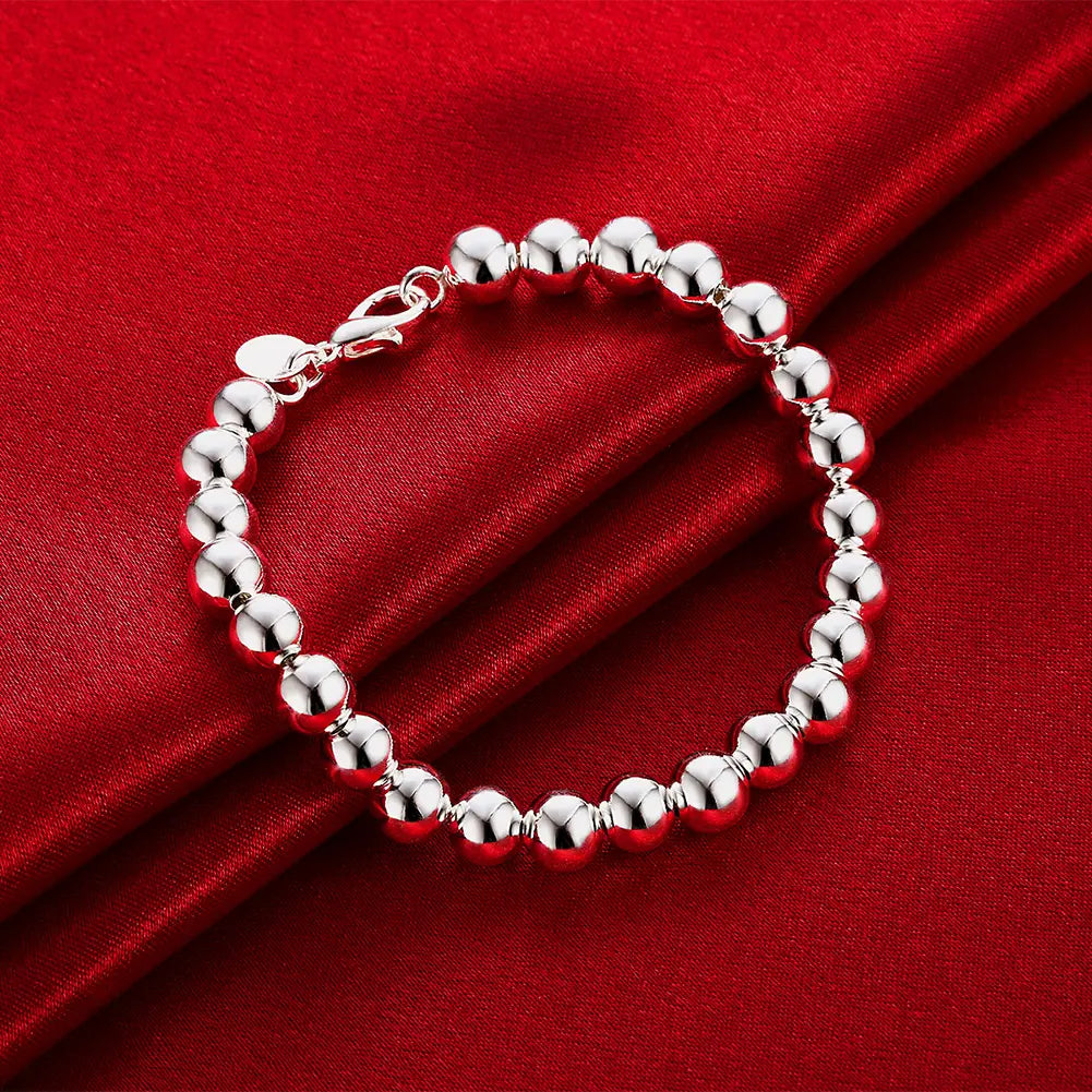 Bracelet en argent orné de perles avec une finition polie et élégante et un fermoir sécurisé, provenant de l’ensemble de bijoux en collier en argent sterling.