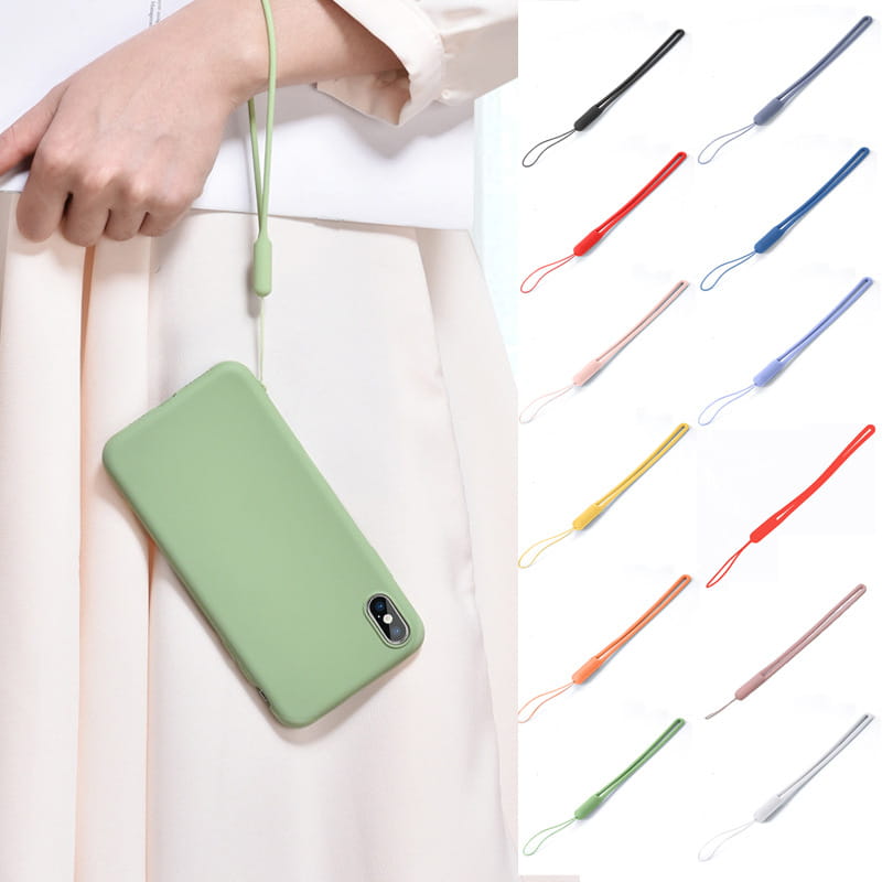 A soft matte sage green silicone phone case with a matching wrist strap shown from the back as part of the silicone phone wrist strap 2 pack.