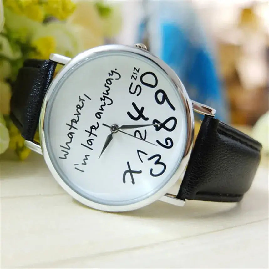 A white-faced funny quote leather strap women watch with black handwritten numerals and the phrase whatever im late anyway featuring a silver-toned case and a black leather strap.