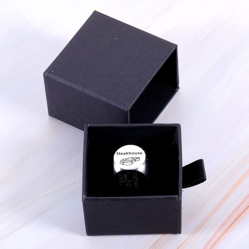 Silver stainless steel food decision ring with circular face engraved with steakhouse and steak illustration in black gift box for couples date night