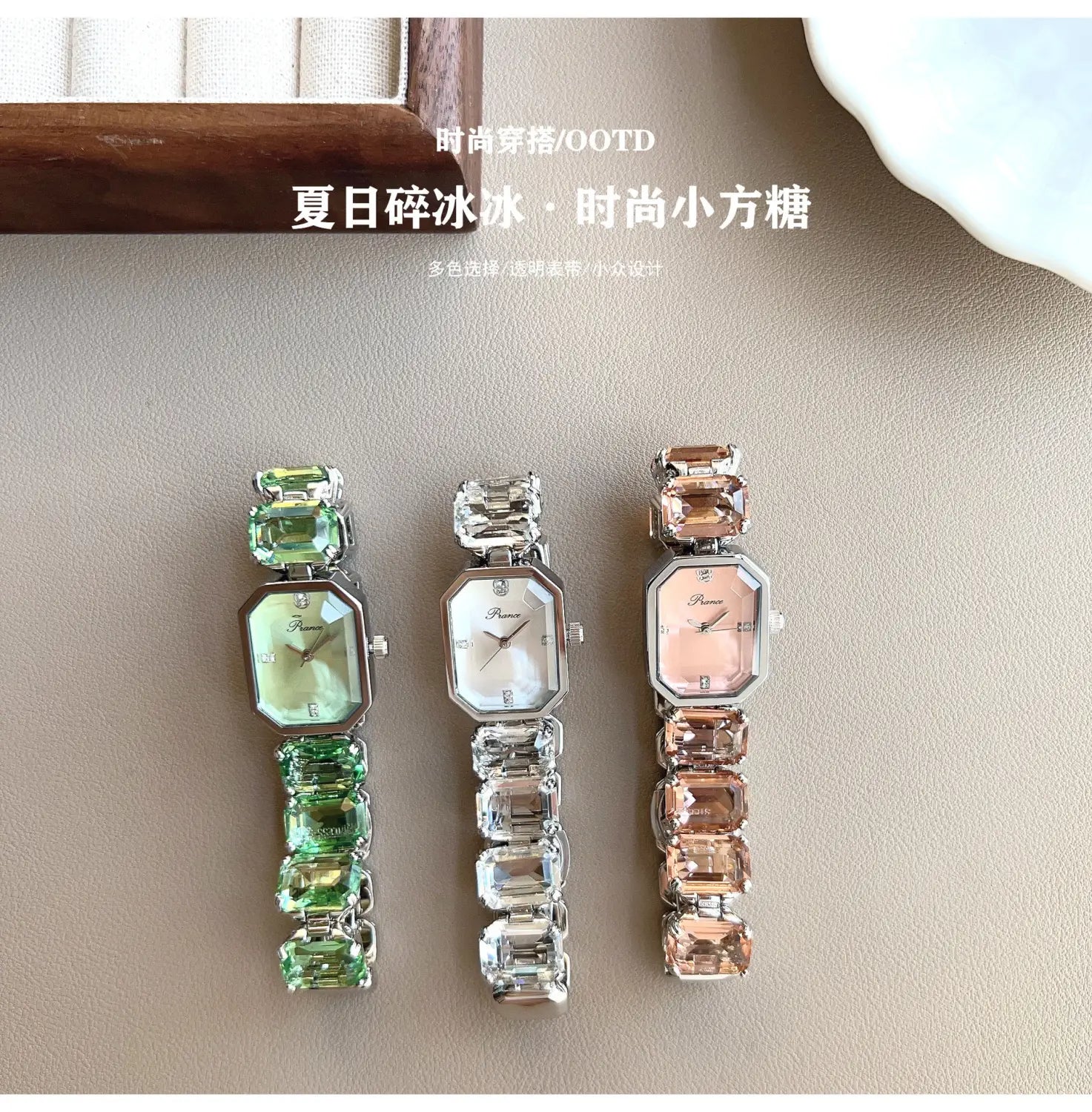 Three elegant women quartz crystal watches with rose gold rectangular faces and gemstone-encrusted bands in green, clear, and rose gold tones.