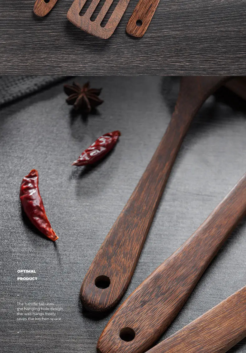 dark brown wooden kitchen utensils with a smooth polished finish and hole designs at the ends ideal for non-stick cookware.