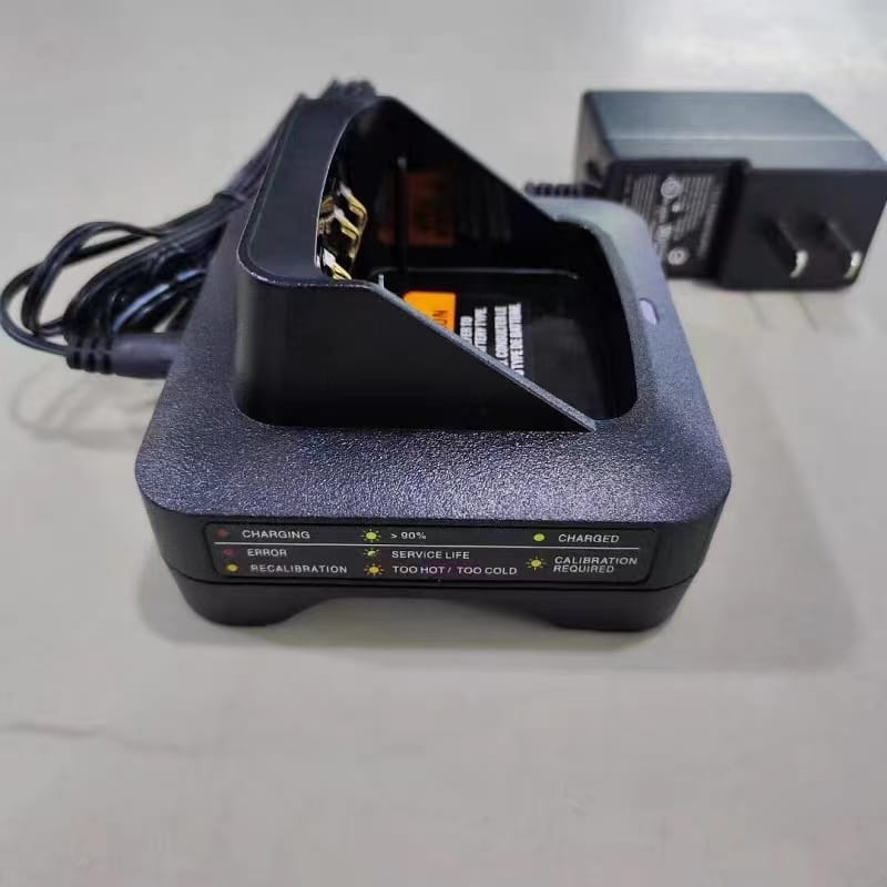 black plastic desktop base charger for motorola xts2500 xts1500 featuring indicator lights for charging status and error codes.
