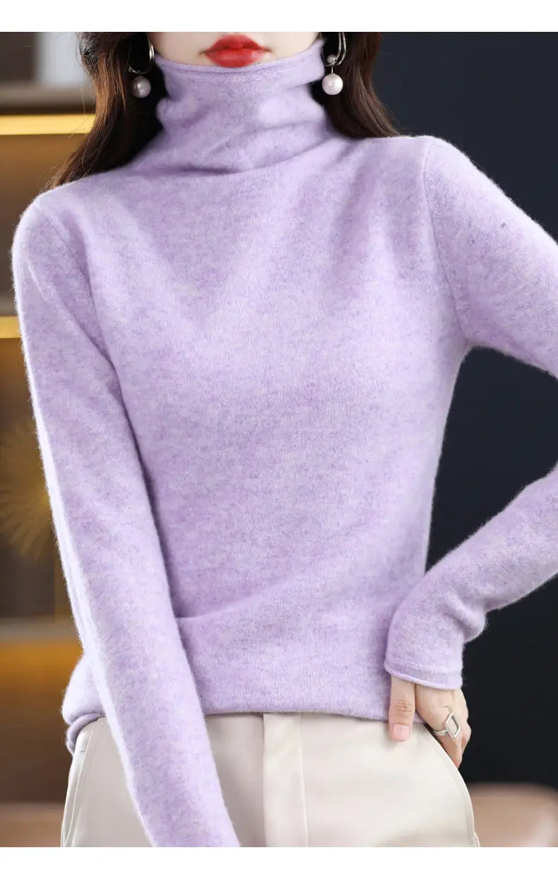A soft lavender merino wool turtleneck sweater for women with a smooth knit texture.