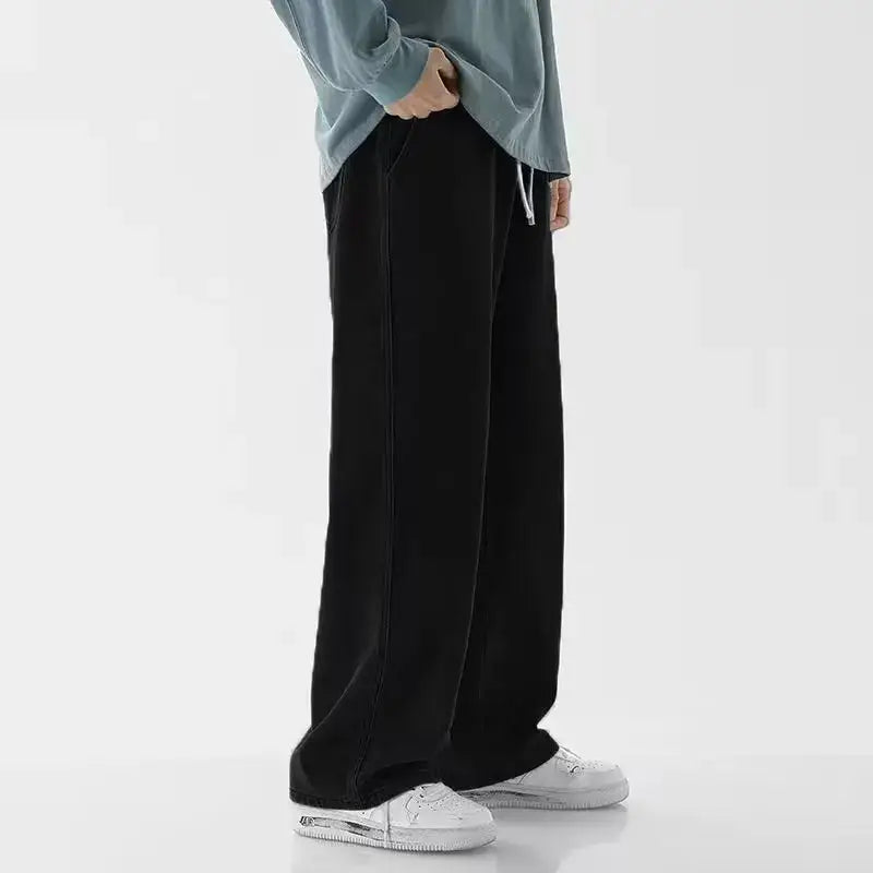 Jeans en denim Y2K à jambes larges et ample pour hommes en noir, coupe décontractée et taille à cordon de serrage