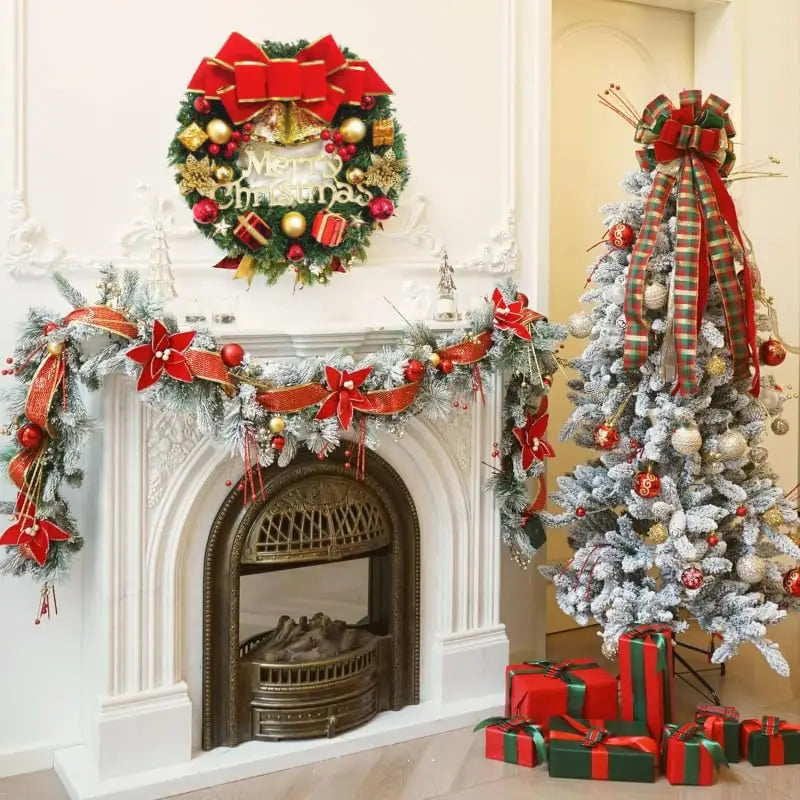 Festive red and green christmas wreath with gold ornaments, a large velvet bow, and merry christmas lettering for holiday door hanging decor.