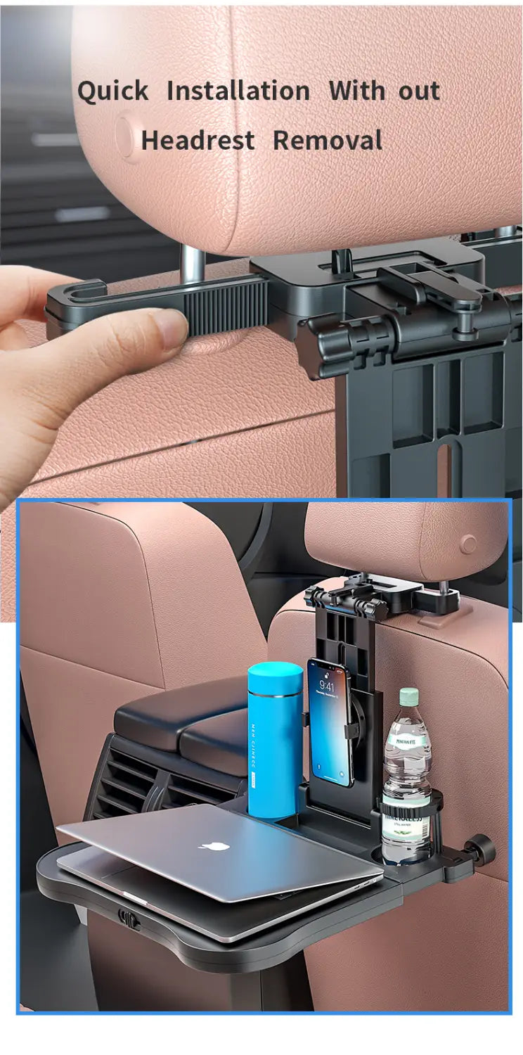 Black plastic car headrest laptop tray and food holder with adjustable arms and cup holders mounted on car seat back side.