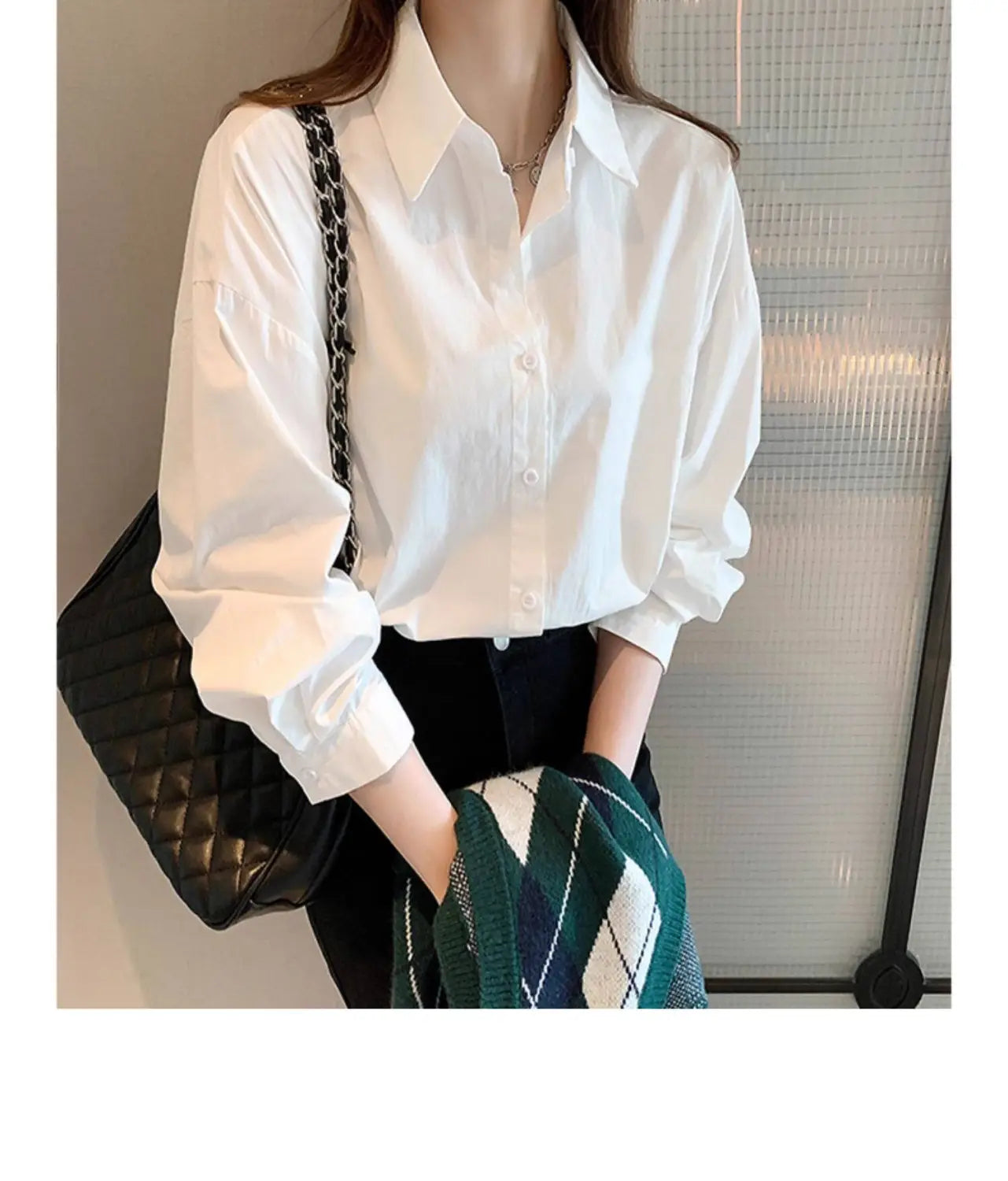 Solid white basic shirt oversized casual button up blouse with long sleeves, classic collar, and rolled cuffs.
