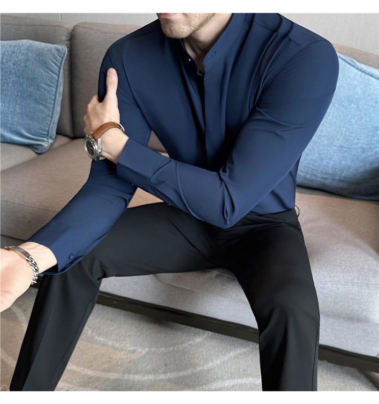 Navy blue slim fit men dress shirt with stand collar and buttoned cuffs designed for a formal look ensuring the correct size for dress shirts.