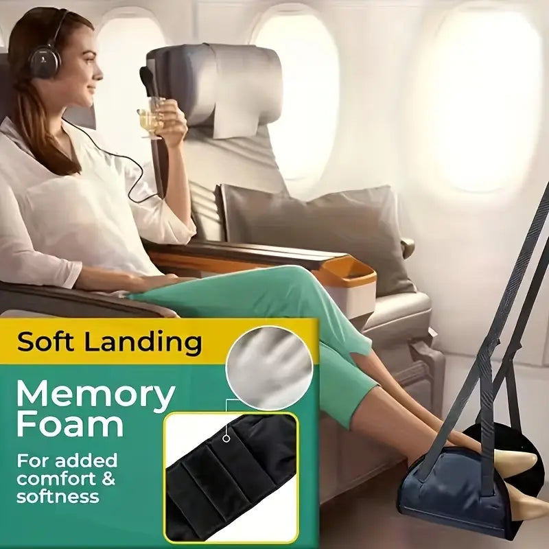 黒色のメモリーフォーム製飛行機用フットレストで、パッド付きストラップを備え、フライト中の快適な使用のための調節可能なトラベルハンモック脚用レストとして設計されています。