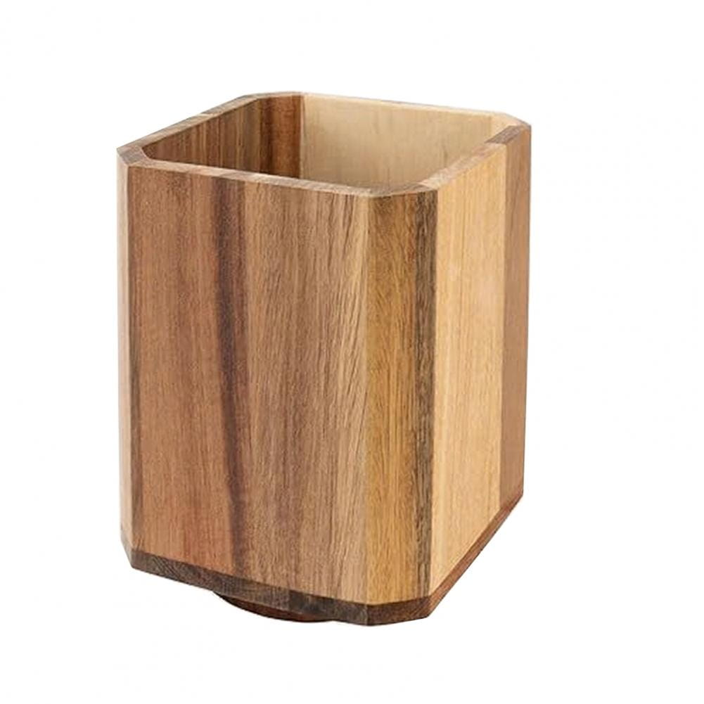 Hexagonal wooden rotating kitchen utensil holder with a natural wood grain finish and visible vertical striations for countertop organization.