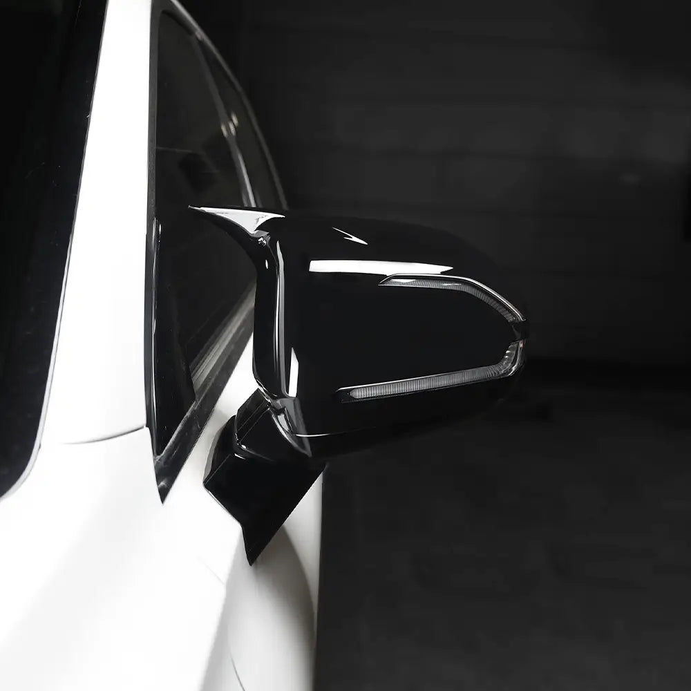 black glossy Hyundai Palisade led mirror cover with sleek angular design and integrated led light strip for 2020-2025 models shown from the back side