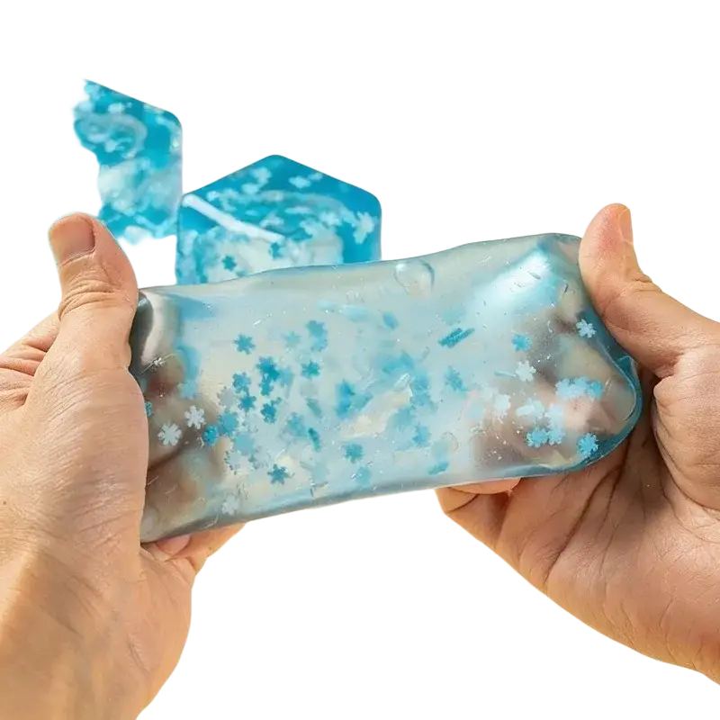 Translucent blue gel ice pack with embedded snowflake particles shown from front for stress relief sensory fidget ball