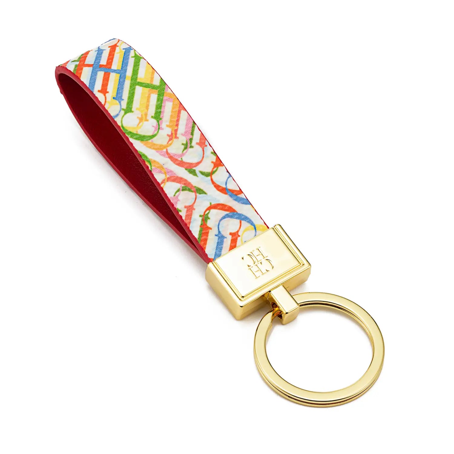 A leather logo keychain featuring a vibrant rainbow-colored fabric strap with a repeating monogram pattern and gold-toned metal hardware designed as a designer fashion accessory gift.