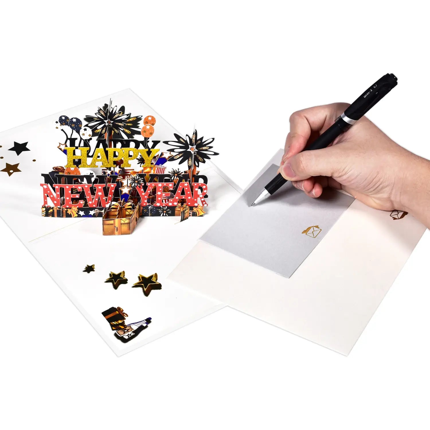 シルバーのクリップと黒いグリップを備えた黒いペンと、華やかなデザインの3Dポップアップ「新年おめでとう」カード。