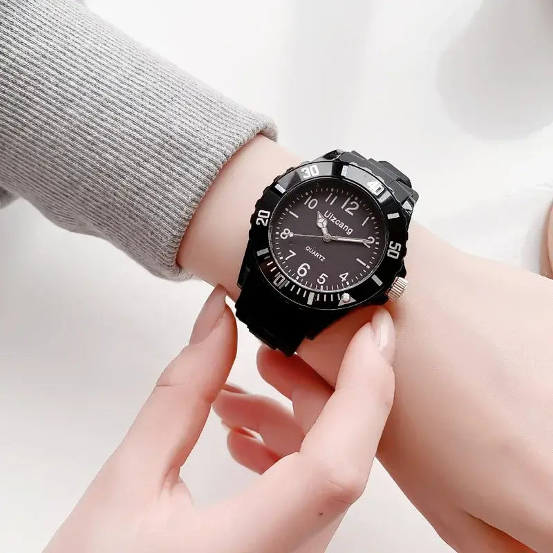 Black quartz kids silicone watch with a bold sporty design and a textured bezel in colorful jelly wristwatch style.