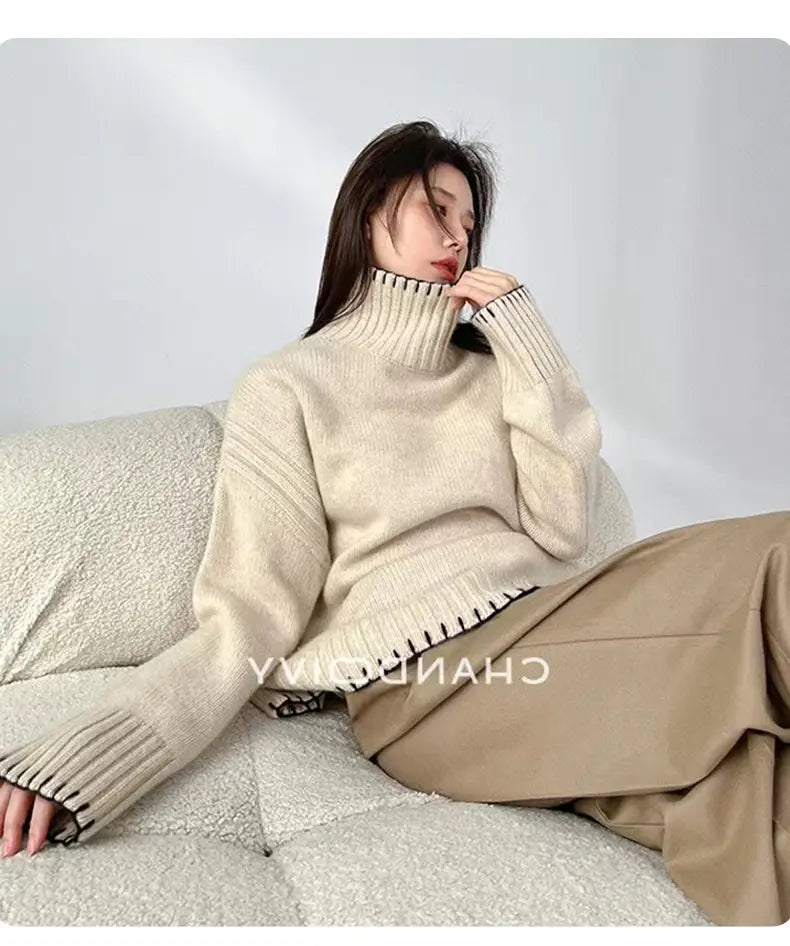 Cream-colored pure wool turtleneck sweater for women with ribbed knit texture and black-trimmed cuffs and hem.