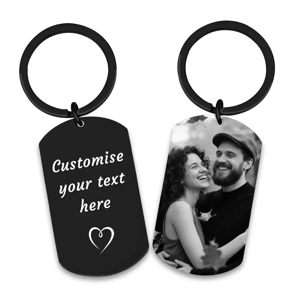 black metal dog tag keychain with one side engraved for personalization and the other side showing a black and white photo of a smiling couple for the custom photo keychain for couples product