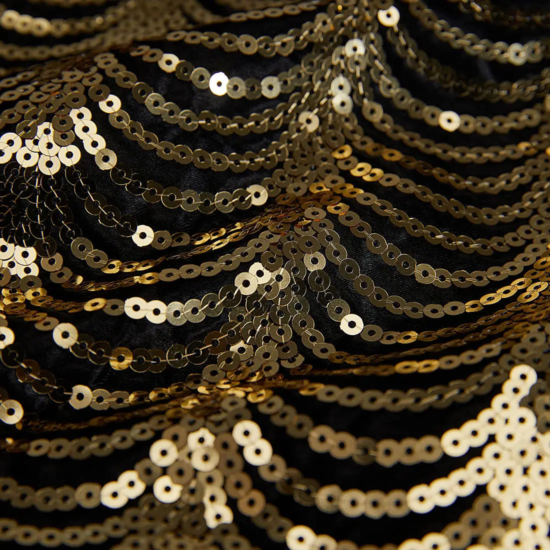 black satin blazer for men featuring gold sequin sleeves with cascading rows of sequins on black fabric.