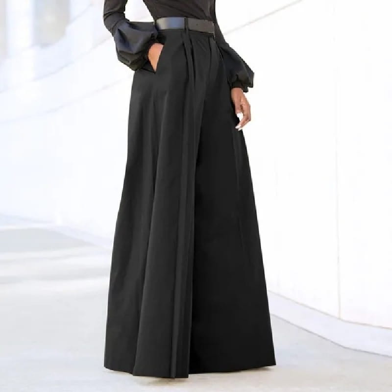 Black high-waisted wide leg tailored trousers featuring a sleek design and subtle pleats for a polished look.
