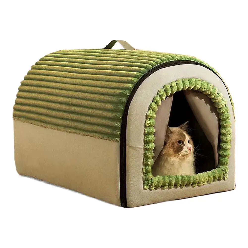 A cozy olive-green and beige corduroy pet bed cave with a plush pom-pom-trimmed entrance made of washable warm cotton.