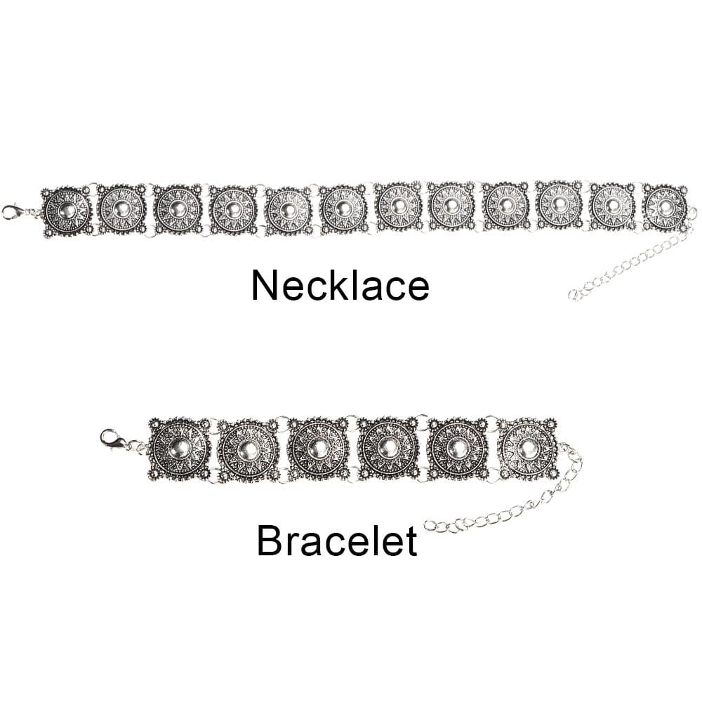 Boho silver vintage jewelry set featuring a silver-toned necklace and bracelet with intricate circular medallion designs and central pearl-like accents.