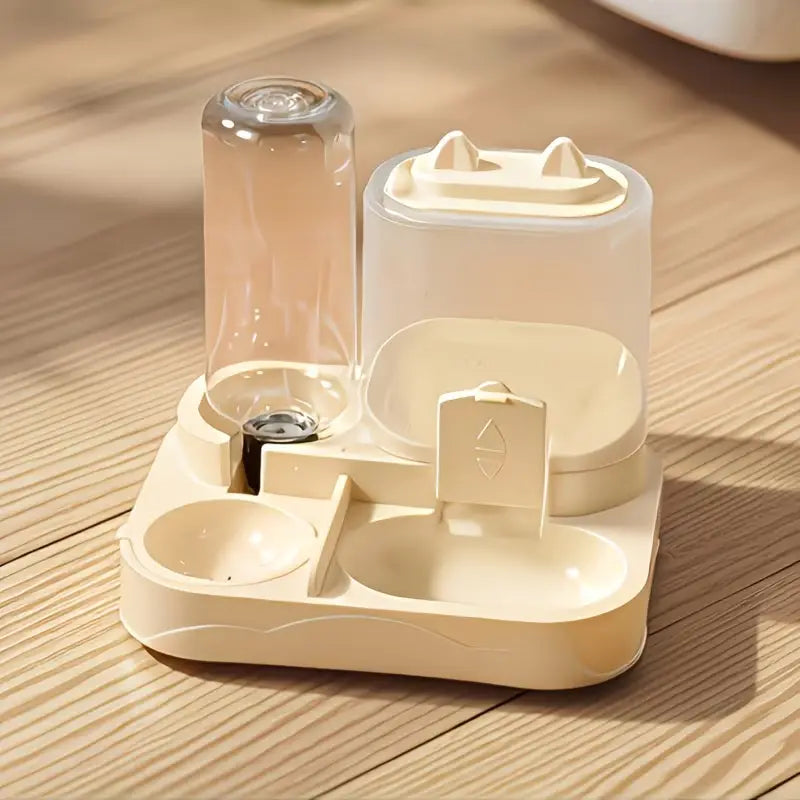 Cream-colored plastic water dispenser and large pet feeder with a clear glass bottle, cat-ear shaped lid, and dual bowls for pet feeding.