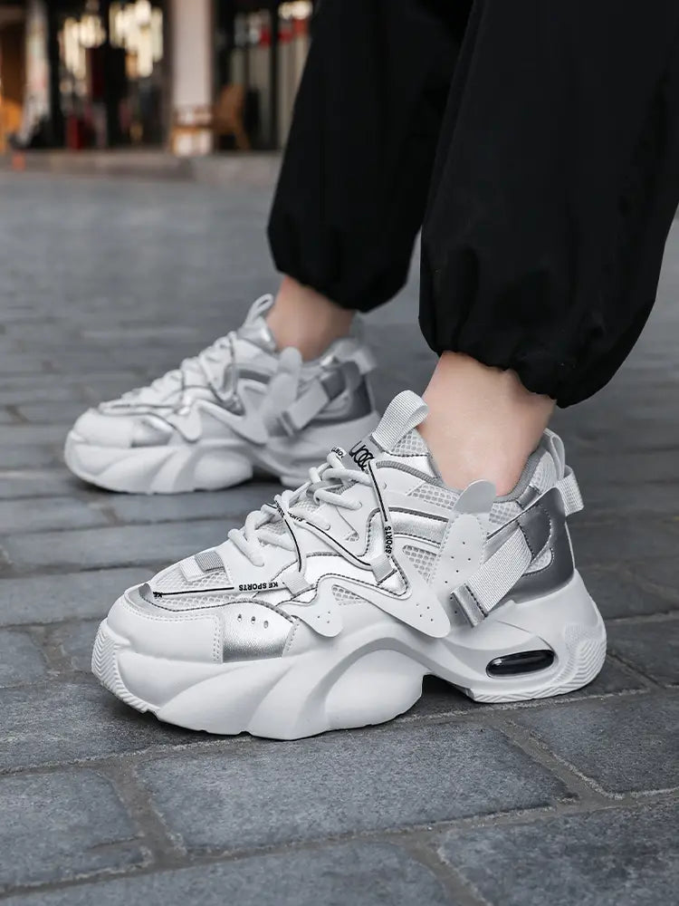 Men chunky air cushion casual sneakers in white and silver featuring a thick cushioned sole and multiple support straps.