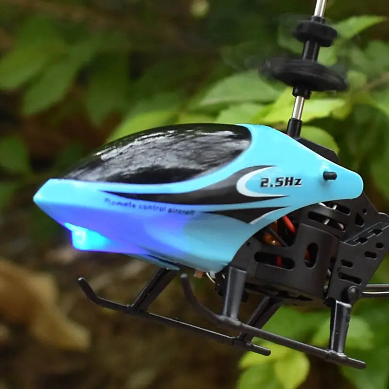 Light blue and black remote control helicopter with glowing blue lights under the body is a high quality toy included in the package.