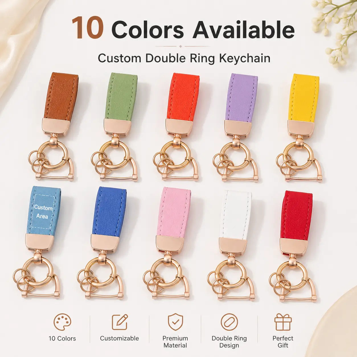 Personalized leather keychain with custom engraved double rings featuring a colorful leather strap and rose gold metal hardware.