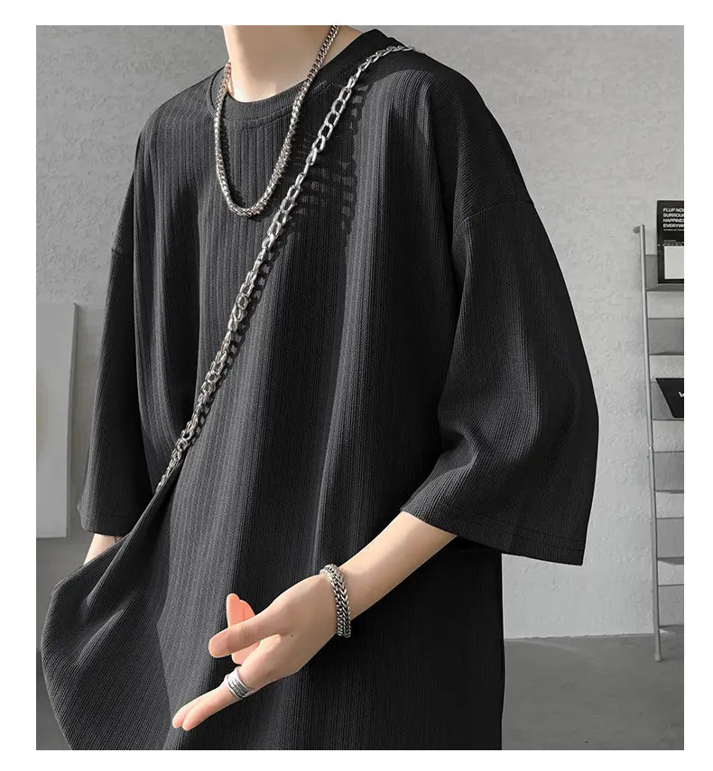 Men striped oversized summer t-shirt in black ribbed knit with three-quarter sleeves and a relaxed fit.