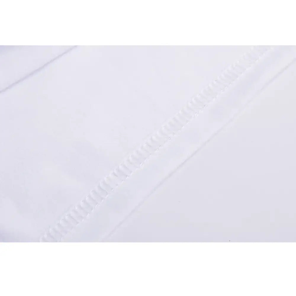 white fabric with a subtle textured pattern and neat even stitching along the edge of a women floral daisy white short sleeve t shirt.
