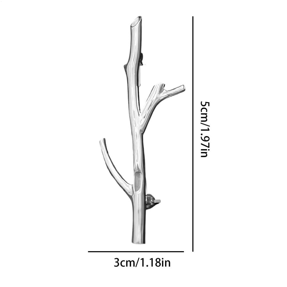 Silver tree branch brooch pin with a sleek metallic finish designed as a natural twig hair clip for fashion corsage use.