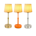 Three adjustable led fabric book light charging touch table lamps in gold orange and silver with beige pleated shades