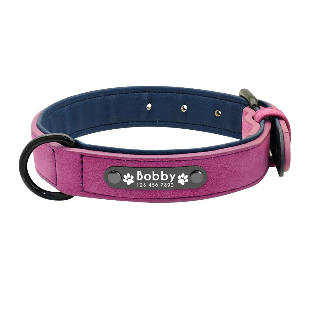 Customized leather dog collar featuring a personalized pink and navy blue design with a metal nameplate engraved with the name Bobby and paw prints for easy customization information.
